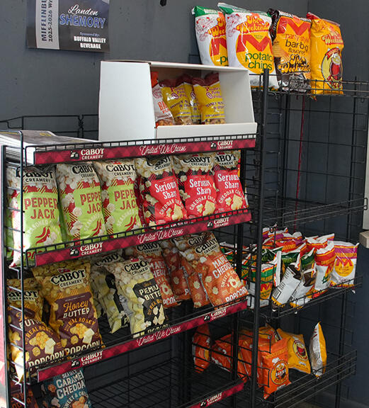 Snack products and convenience items displayed inside a beer and beverage store.